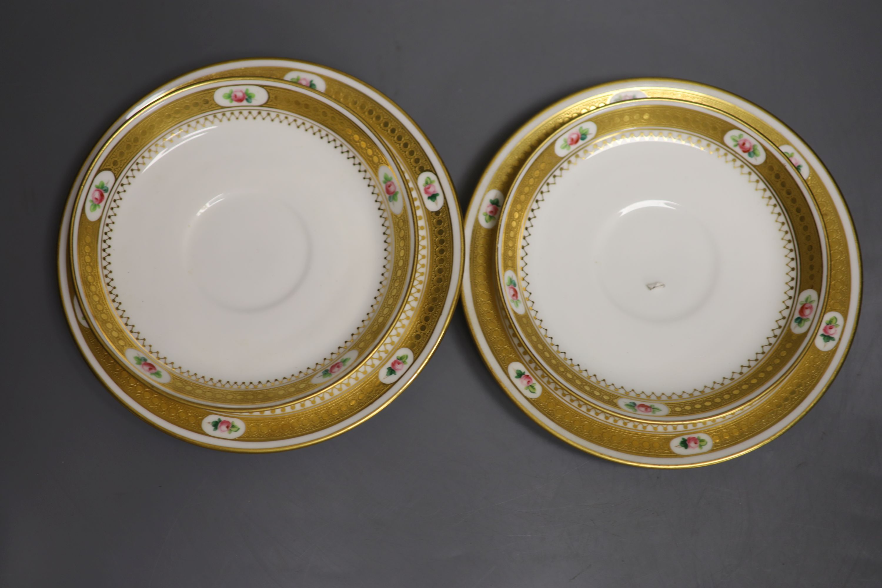 A pair of Minton coffee cups and saucers & pair Minton trios